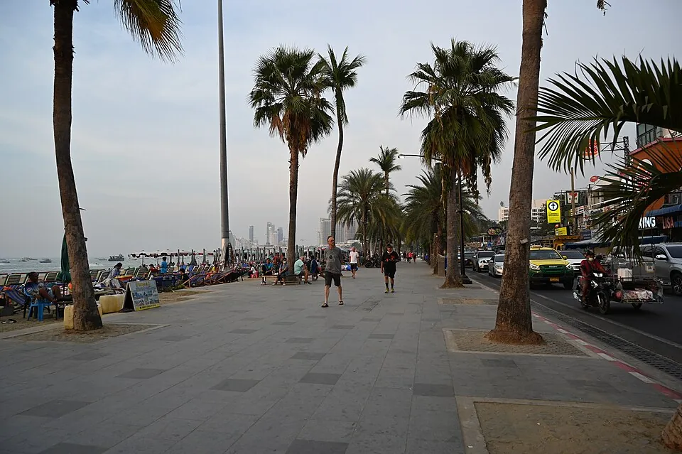 Crowded promenade with many pedestrians walking
